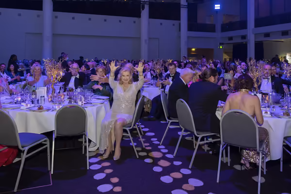 Guests gathered at a formal event with live entertainment